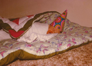 The original owner of the "Christmas Mushroom" quilt, cozily bringing in the New Year, 1978